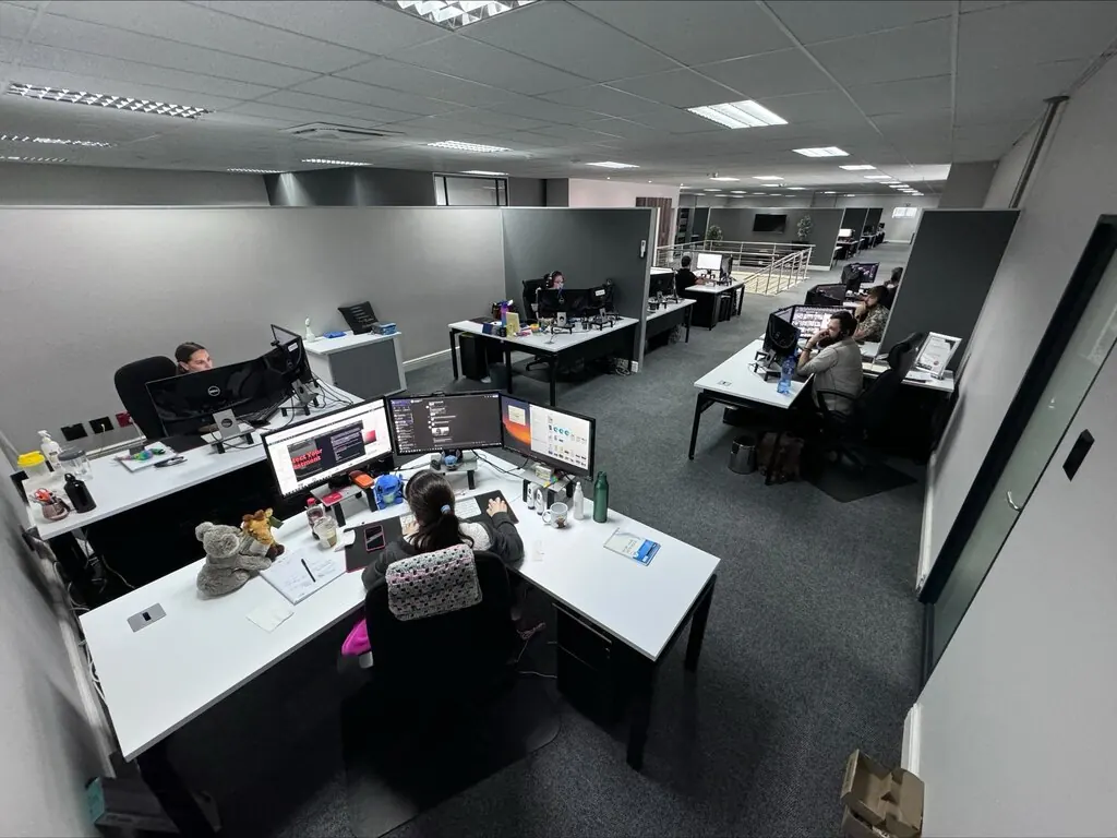 Team members working at their desks